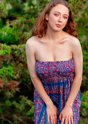 Esenia Reveals With A Playful Upskirt Glimpse Of Her Bare Pussy