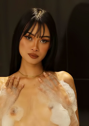 In the jacuzzi, Ryn playfully teases while enjoying an ice cream cone