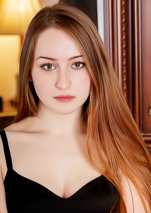 Evelin Her Soft Breasts Bare And Her Mesmerizing Blue Eyes Shining Seductively