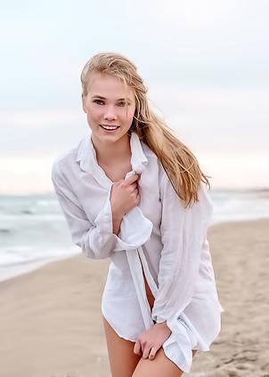 Luise Entices With A Beach Striptease Revealing Perky Nipples And Grabbing Her Curves