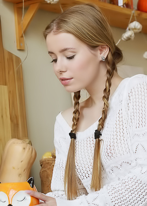 Lalli Plays With Her Pigtails Before Bending Over For An Upskirt Flash Of Her Shaved Pussy