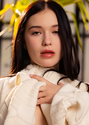 Wikki K Kneels Gently On A Couch In Yellow Lingerie