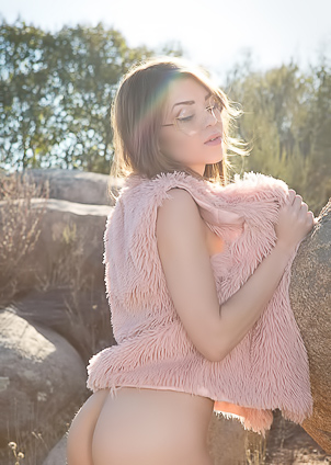 Drew Catherine and Willa Prescott posing nude outdoors on rocks and blankets in sunlight