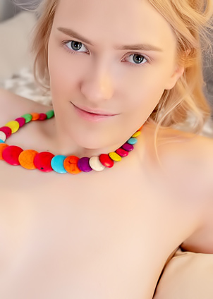 Lexmi Teases with a Playful Naked Pose, Erect Nipples Aimed Your Way